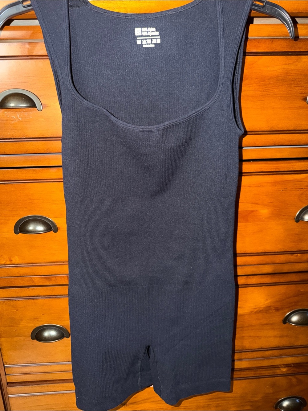 Womanβs black spandex romper